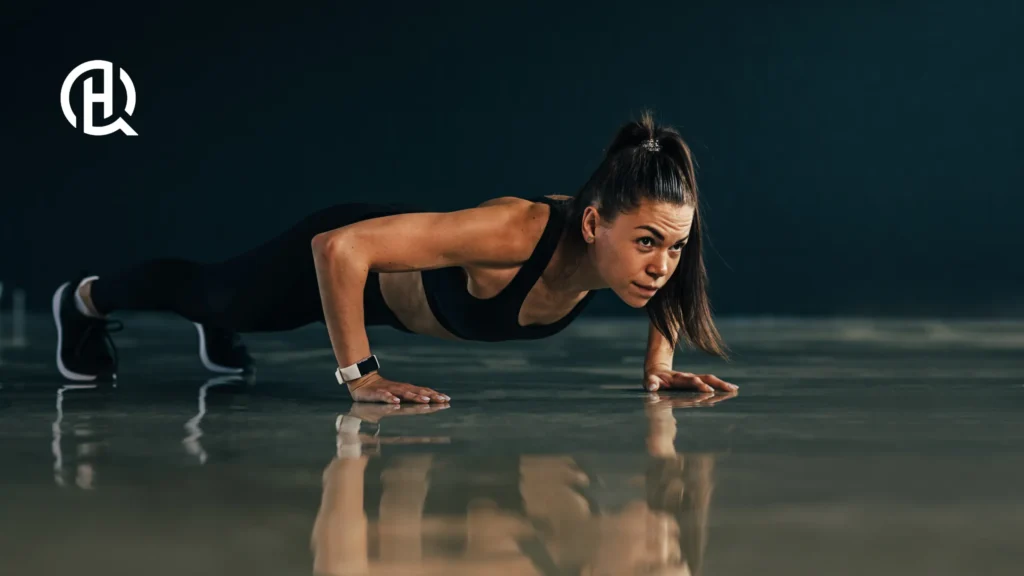 Girld in black tube doing Push-ups