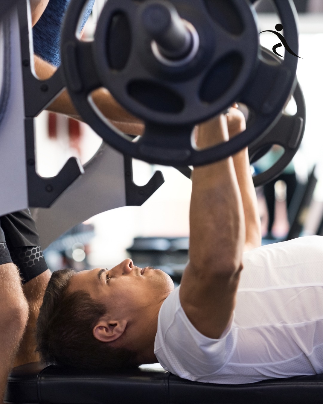 Image of the guy doing a barbell bench press workout