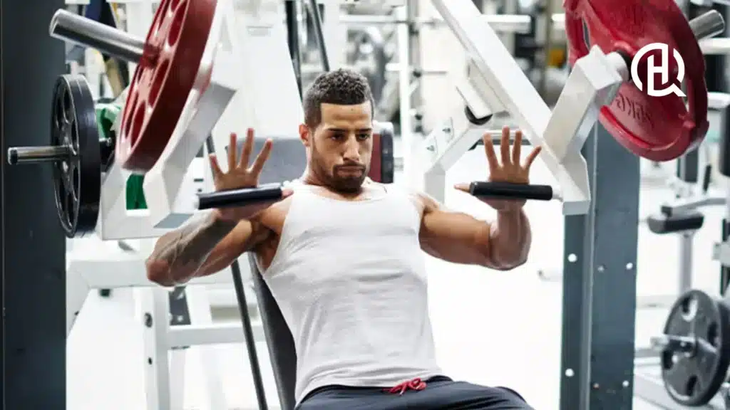 Man in white shirt doing chest exercises