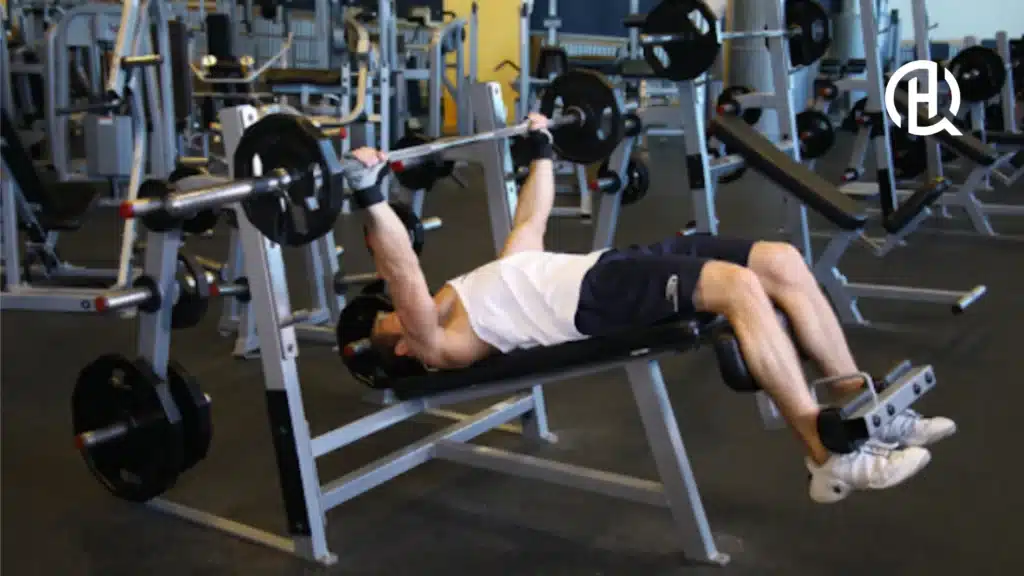 Man in white shirt doing chest exercises