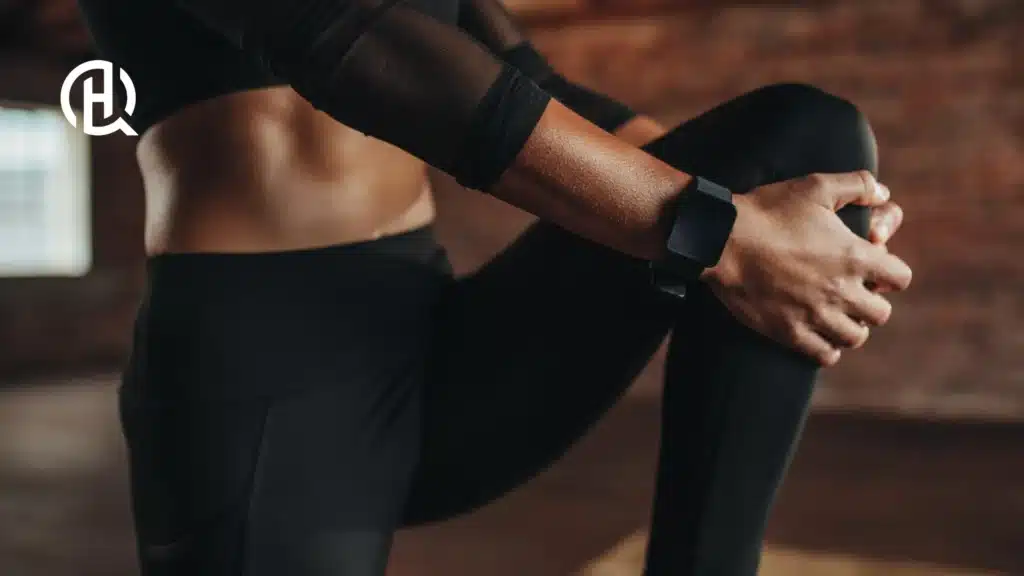 Girl in black gym clothes doing warm ups