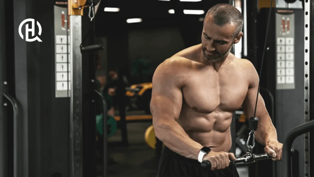 Shirtless man dooing triceps pressdown