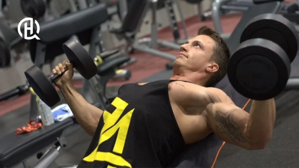 Man doing a chest exercise while lying on the bench