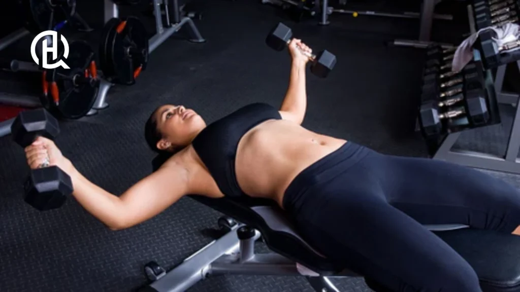 Girl doing barbell fly