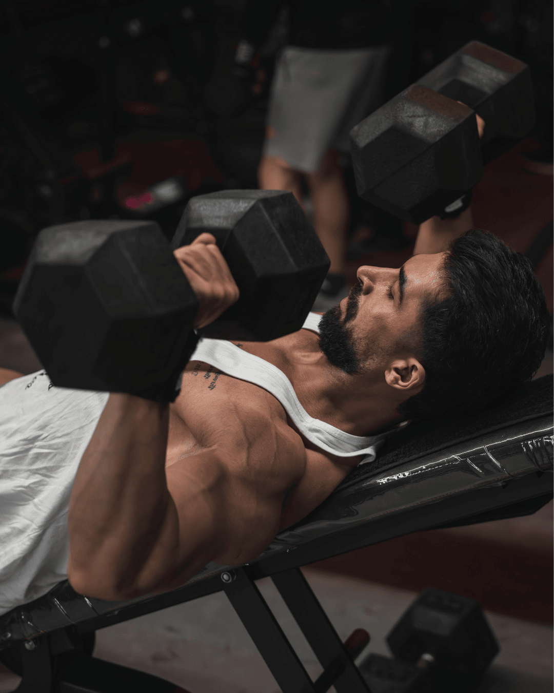 Image of guy doing the incline dumbbell bench press