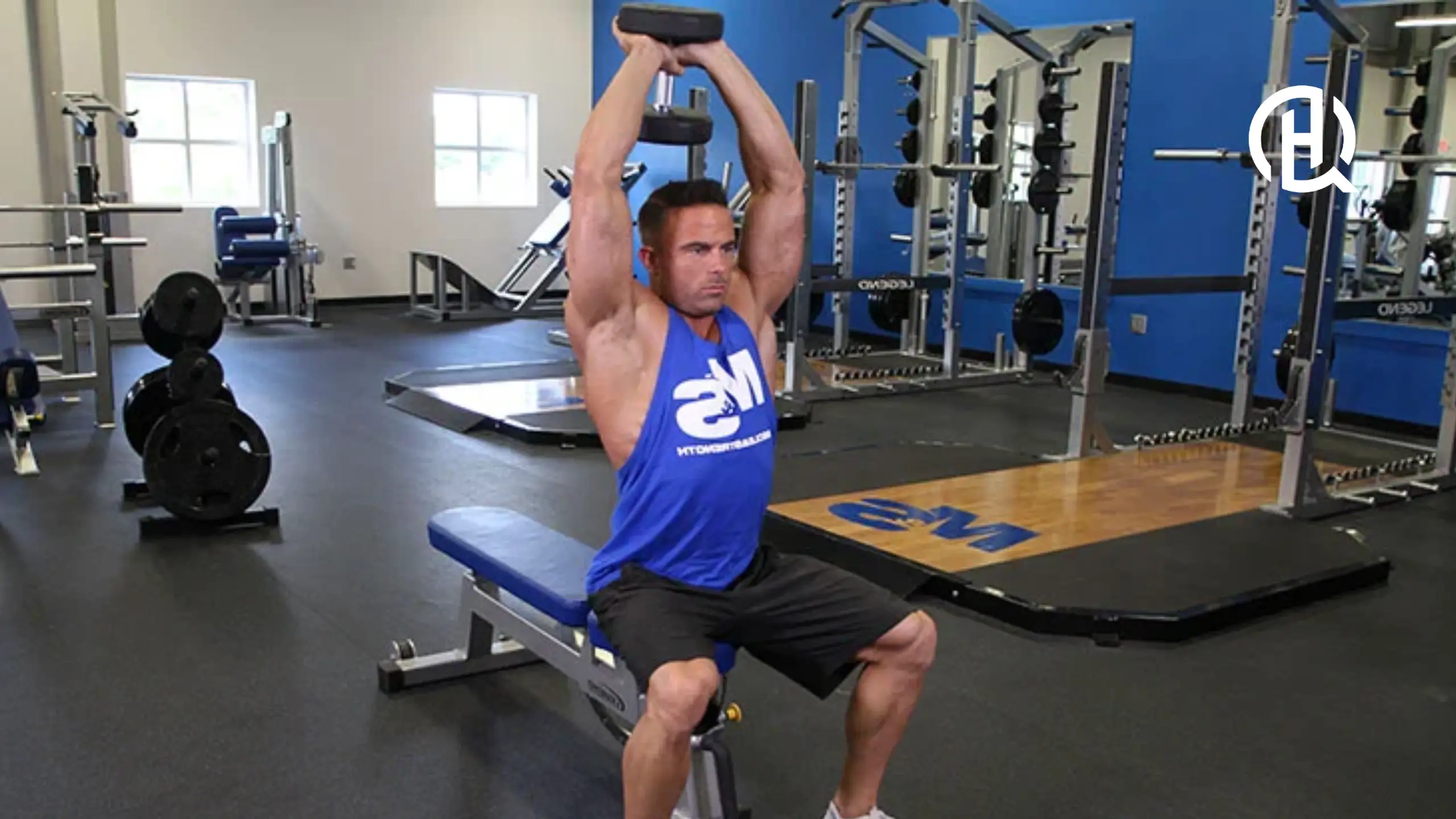 Man in blue sando doing Dumbbell Overhead Triceps Extension