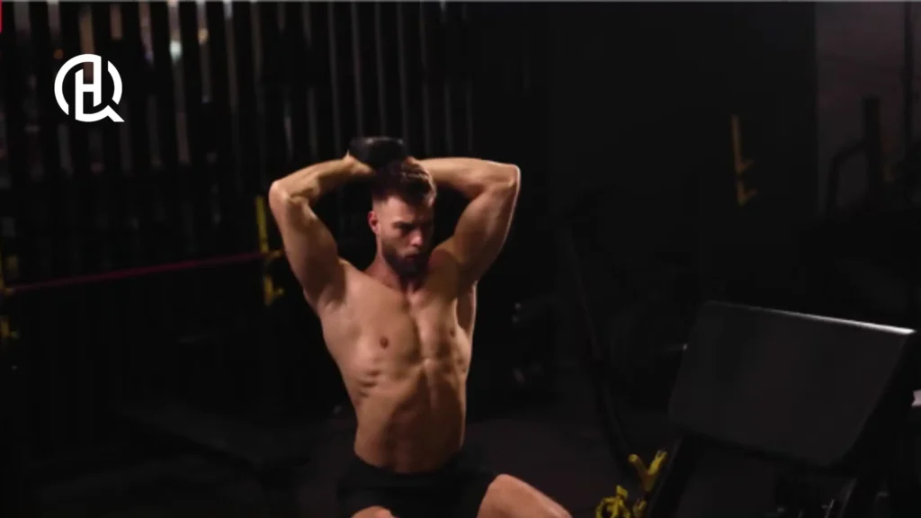 Topless man doing Dumbbell Overhead Triceps Extension