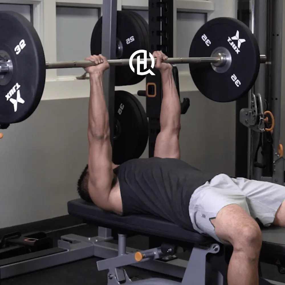 Man in black sando doing Close-Grip Bench Press