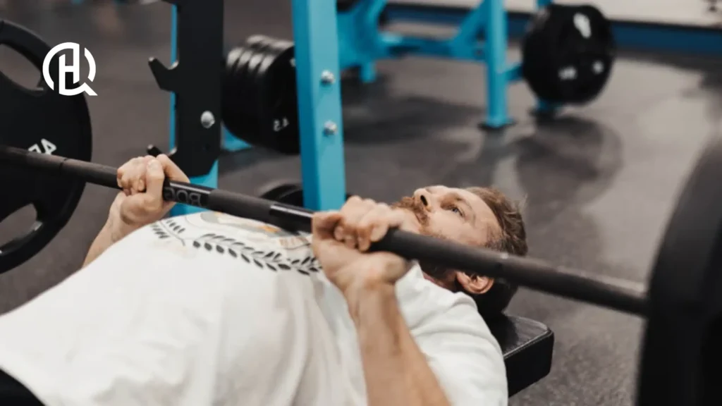 Guy in wearing white shirt doing Close-Grip Bench Press