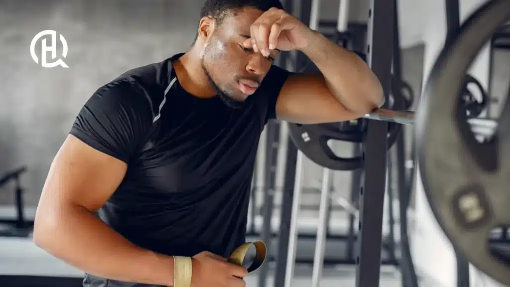 A man being sweaty posing for the camera.