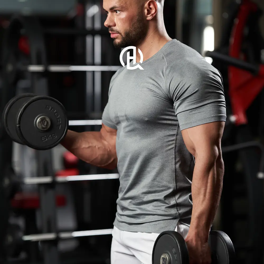 Man in gray tshirt doing bicep exercises