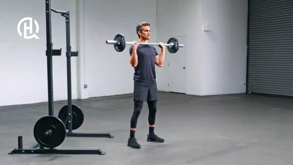 A man in a studio doing bicep exercises