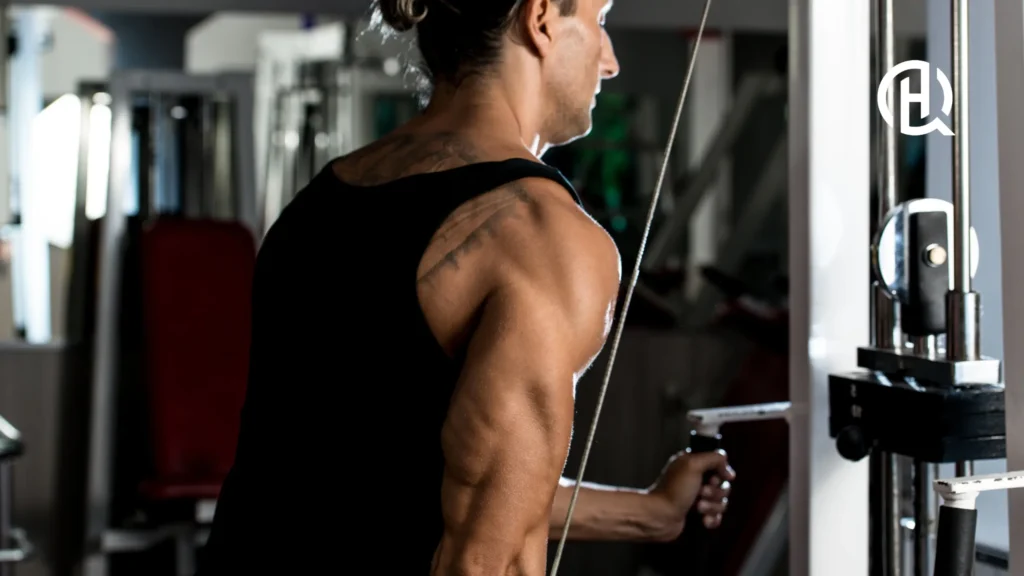 Man in a gym doing Single-Arm Cable Triceps Extension