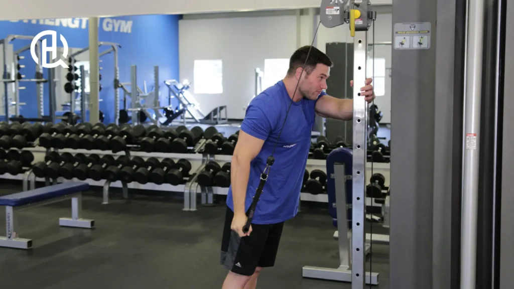 A man doing Single-Arm Reverse Grip Cable Triceps Extension