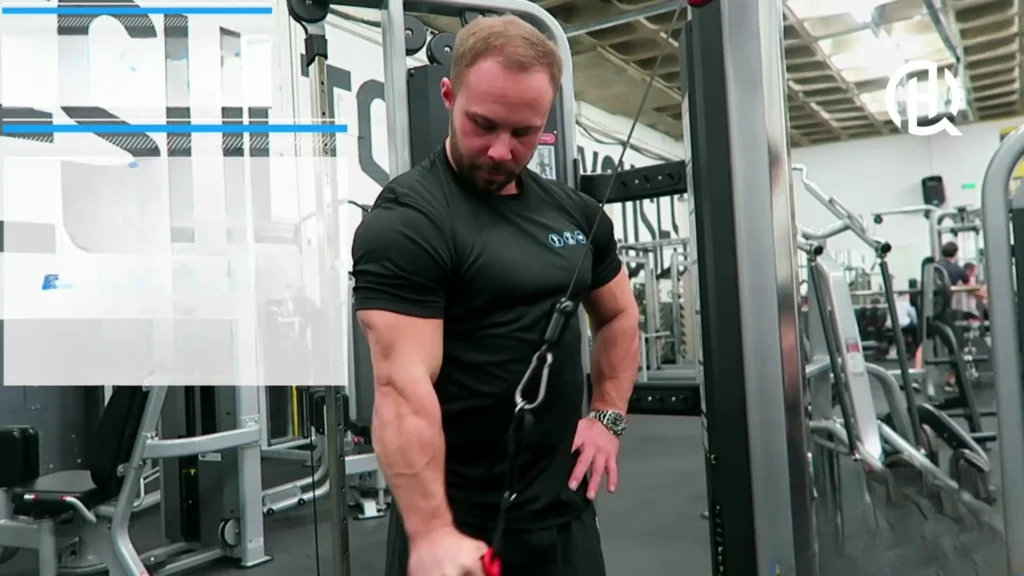 A man showing how to do the Single-Arm Reverse Grip Cable Triceps Extension