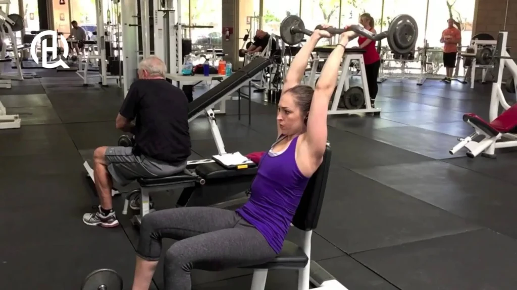 woman doing Seated Barbell French Press