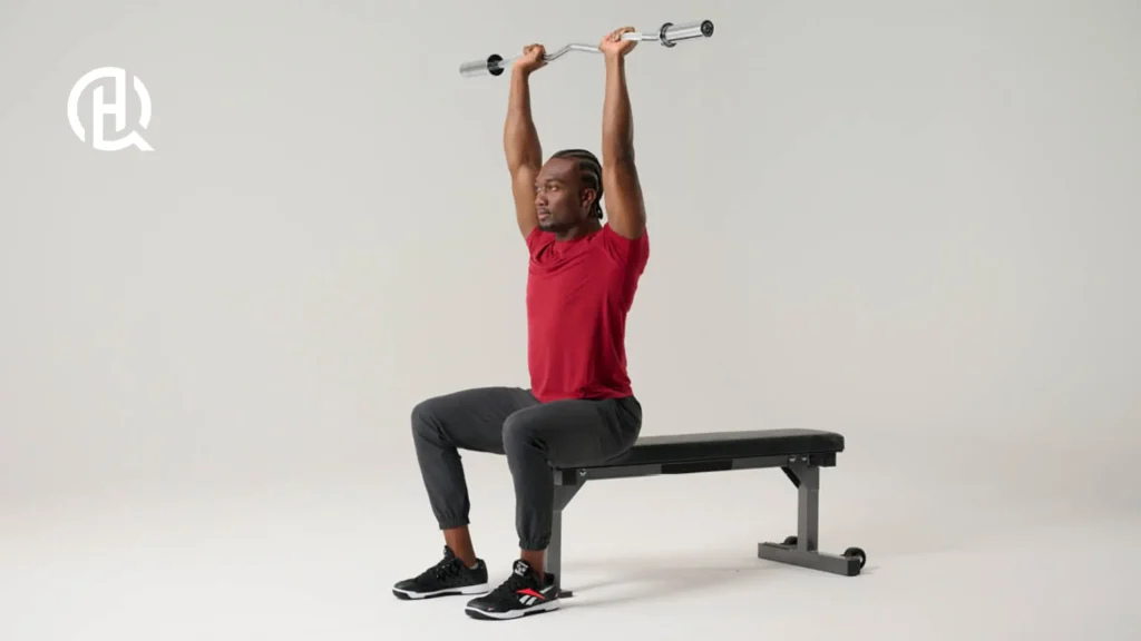 Man doing Seated Barbell French Press
