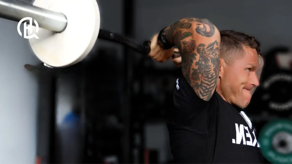 Man doing Seated Barbell French Press