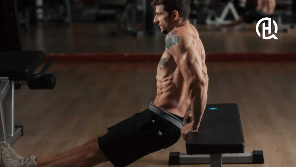 man doing Bench Dips without tshirt, showing his muscles