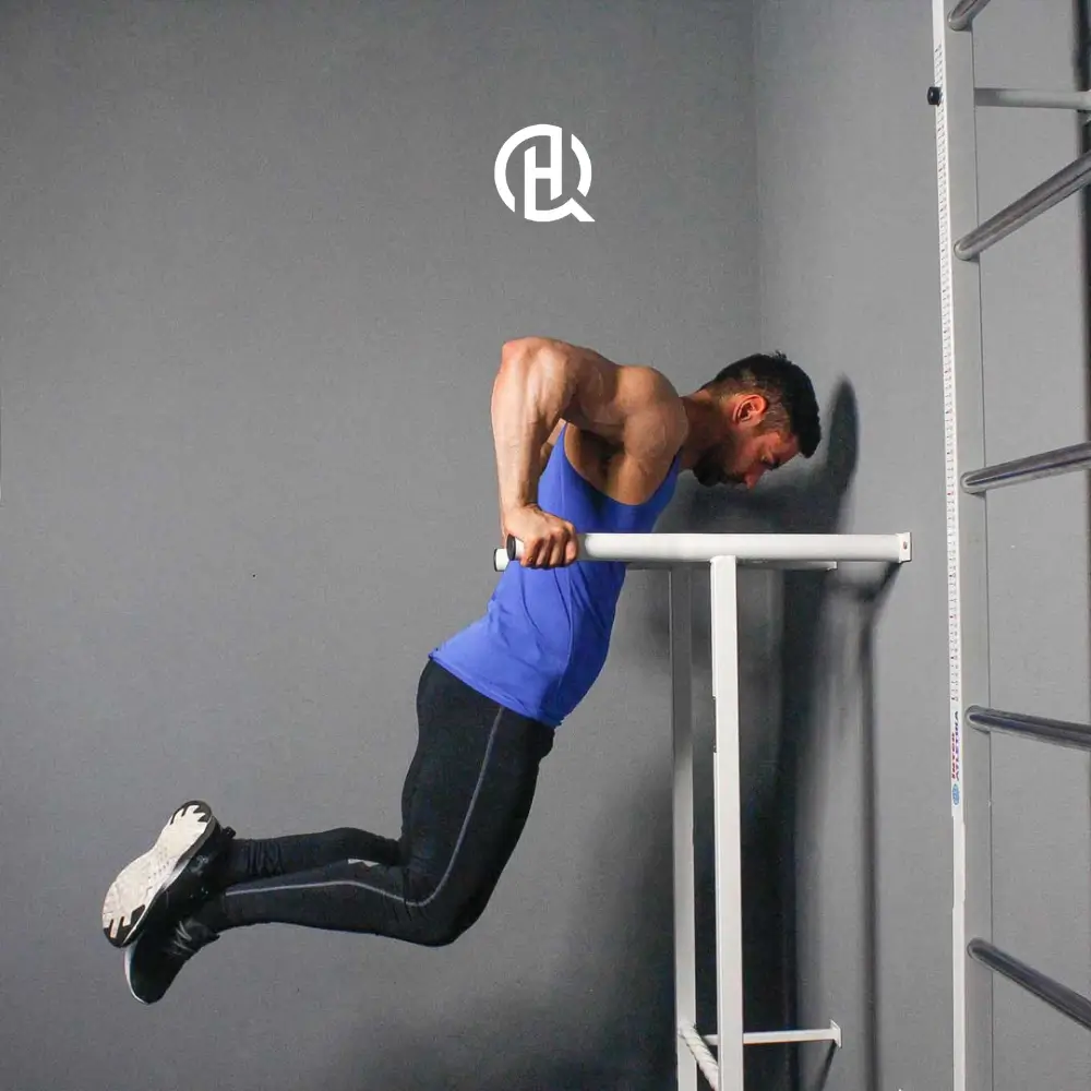 Man doing parallel bar dips