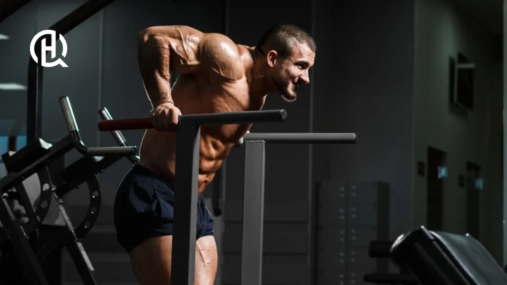A big musclular man doing dips.