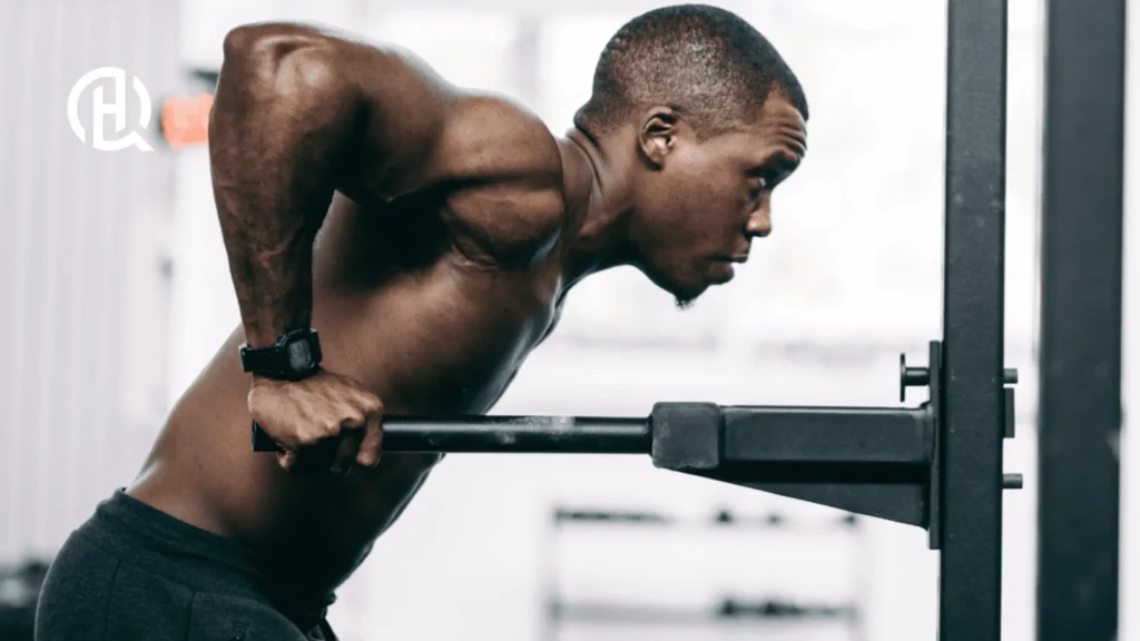 Man doing parallel bar dips on a straight bar.