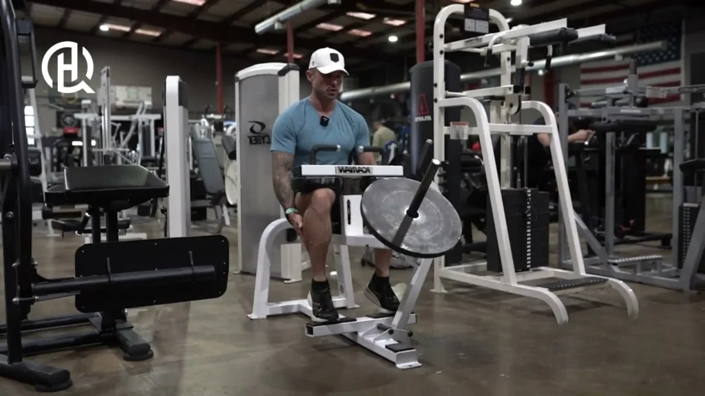 A person doing seated calf raise, making sure to contract the muscles.