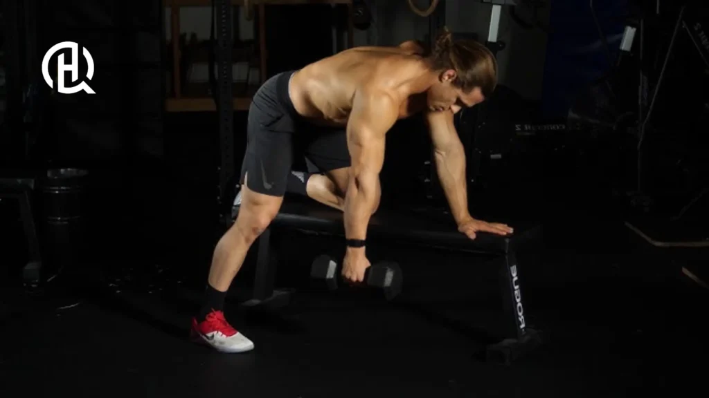 A man doing Dumbbell Bent-Over Row, facing the camera.