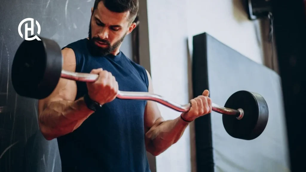 Man working out, doing bicep curl with an ez bar.
