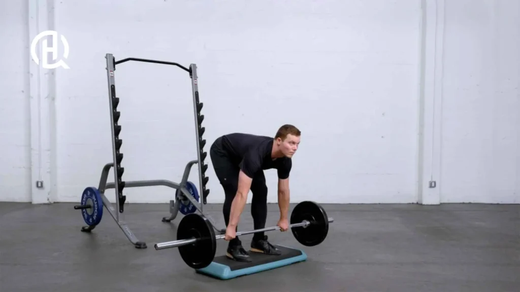 A person doing stiff legged deadlift.